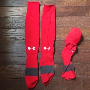 Two pairs of red under armour soccer socks